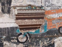 Jatinegara’s Secret Wall: From Broken Bottles to Condoms